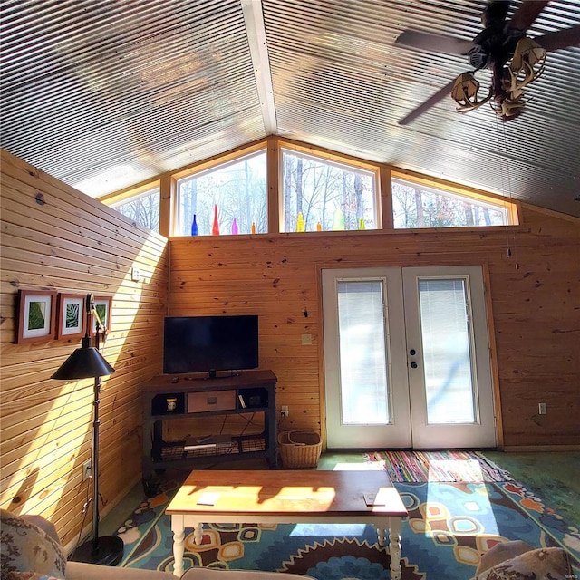 1432 Wayne 523, Wappapello, MO 63966 - carpeted living room featuring wood walls, plenty of natural light, vaulted ceiling, french doors, and ceiling fan