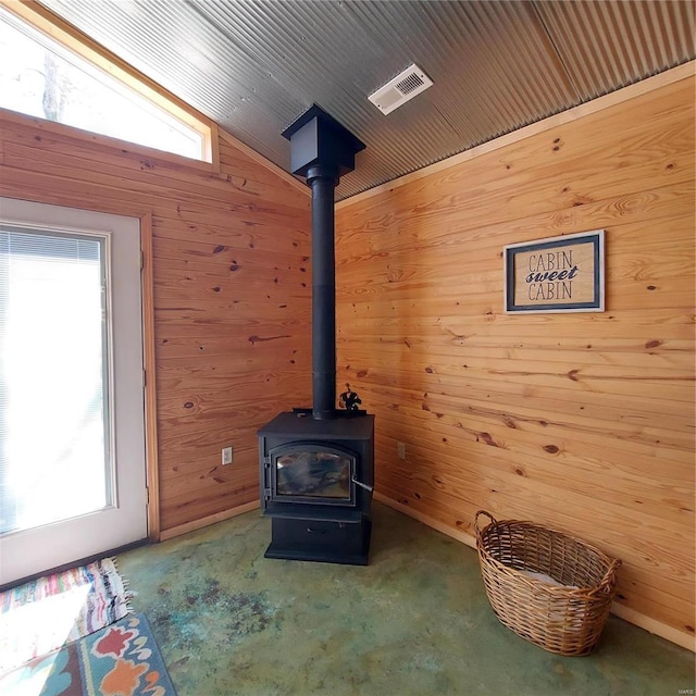 1432 Wayne 523, Wappapello, MO 63966 - detailed view of wooden walls, a wood stove, and carpet floors