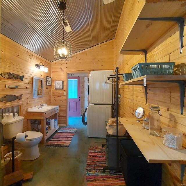 1432 Wayne 523, Wappapello, MO 63966 - bathroom featuring concrete floors, wood walls, toilet, and a chandelier