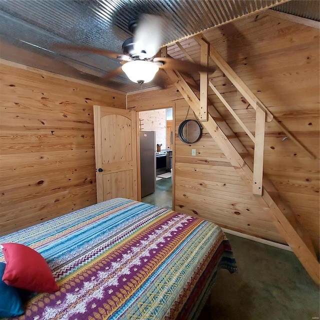 1432 Wayne 523, Wappapello, MO 63966 - bedroom with wood walls, freestanding refrigerator, and carpet