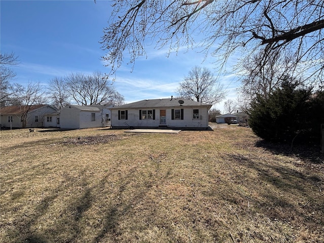 rear view of house with a lawn