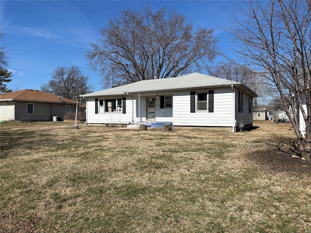 single story home featuring covered porch and a front yard