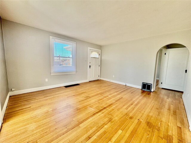 922 S 6th St, Belleville, IL 62220 - entryway with light wood finished floors, arched walkways, and baseboards