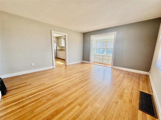922 S 6th St, Belleville, IL 62220 - empty room with light wood-type flooring and baseboards