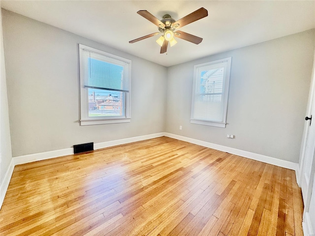 922 S 6th St, Belleville, IL 62220 - spare room featuring light wood-style floors, baseboards, and ceiling fan