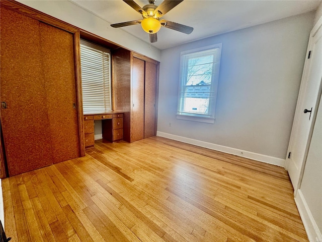 922 S 6th St, Belleville, IL 62220 - unfurnished bedroom featuring light wood finished floors, a closet, ceiling fan, and baseboards