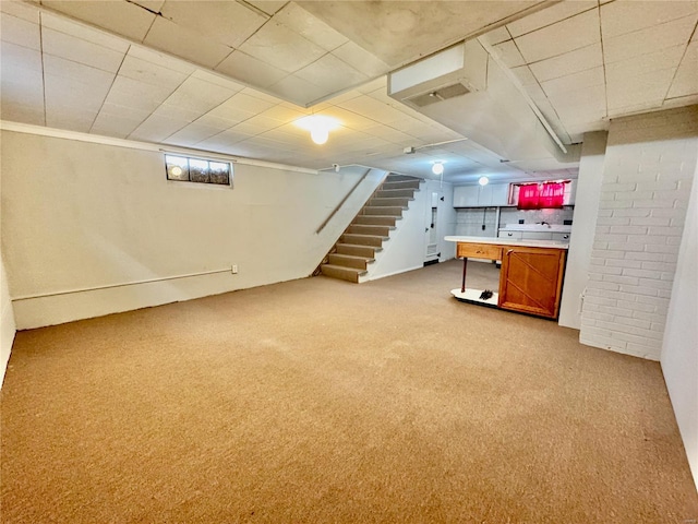 922 S 6th St, Belleville, IL 62220 - below grade area with carpet floors, stairway, and a paneled ceiling