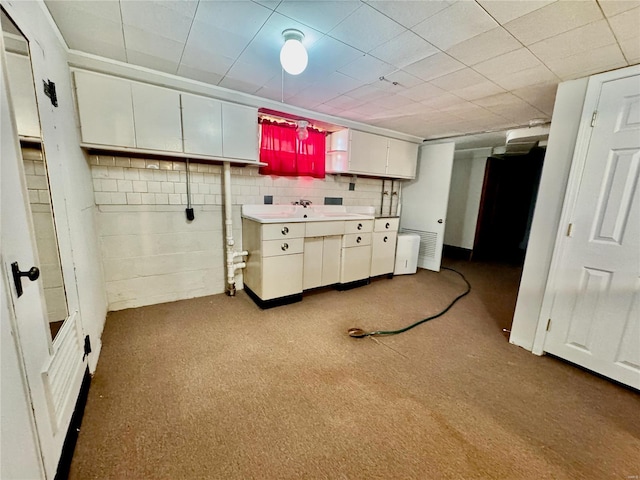 922 S 6th St, Belleville, IL 62220 - kitchen featuring white cabinetry and carpet floors