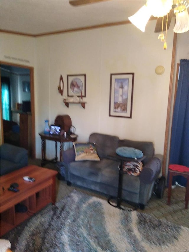 living area with a ceiling fan