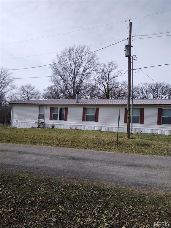 1030 Butler Rd, Tilden, IL 62292 - manufactured / mobile home featuring a front lawn and metal roof