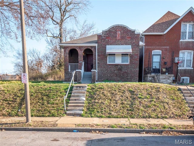 5109 Cote Brilliante Ave, Saint Louis, MO 63113 - view of front facade with brick siding and covered porch