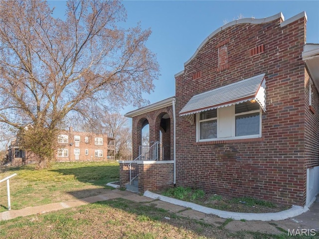 5109 Cote Brilliante Ave, Saint Louis, MO 63113 - view of front of home with brick siding and a front lawn