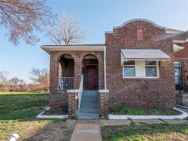 5109 Cote Brilliante Ave, Saint Louis, MO 63113 - view of front facade featuring brick siding and a front yard