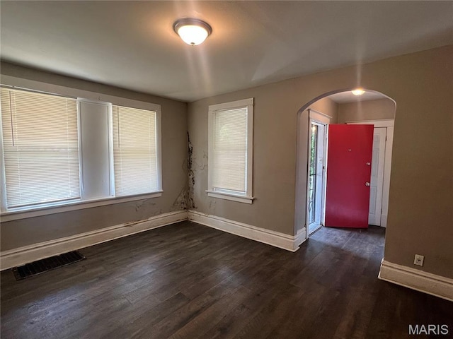 5109 Cote Brilliante Ave, Saint Louis, MO 63113 - entrance foyer with arched walkways and dark wood-type flooring