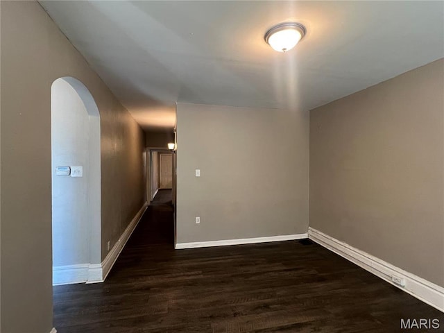 5109 Cote Brilliante Ave, Saint Louis, MO 63113 - spare room featuring wood finished floors and arched walkways