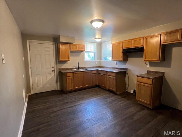 5109 Cote Brilliante Ave, Saint Louis, MO 63113 - kitchen with under cabinet range hood and dark wood-type flooring