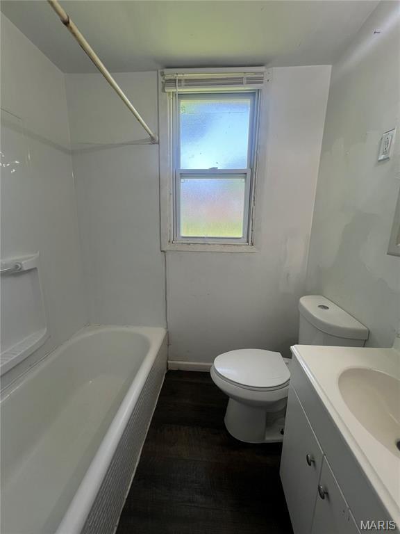 5109 Cote Brilliante Ave, Saint Louis, MO 63113 - full bathroom with vanity, shower / bathtub combination, and wood finished floors