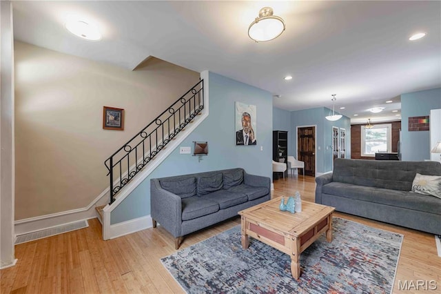 2244 Nebraska Ave, Saint Louis, MO 63104 - living room featuring stairs, wood finished floors, and recessed lighting