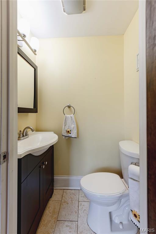 2244 Nebraska Ave, Saint Louis, MO 63104 - half bath featuring vanity and tile patterned floors