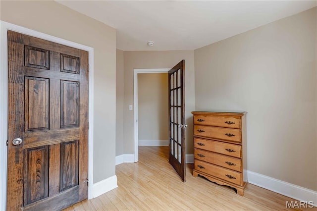 2244 Nebraska Ave, Saint Louis, MO 63104 - bedroom featuring light wood finished floors and french doors
