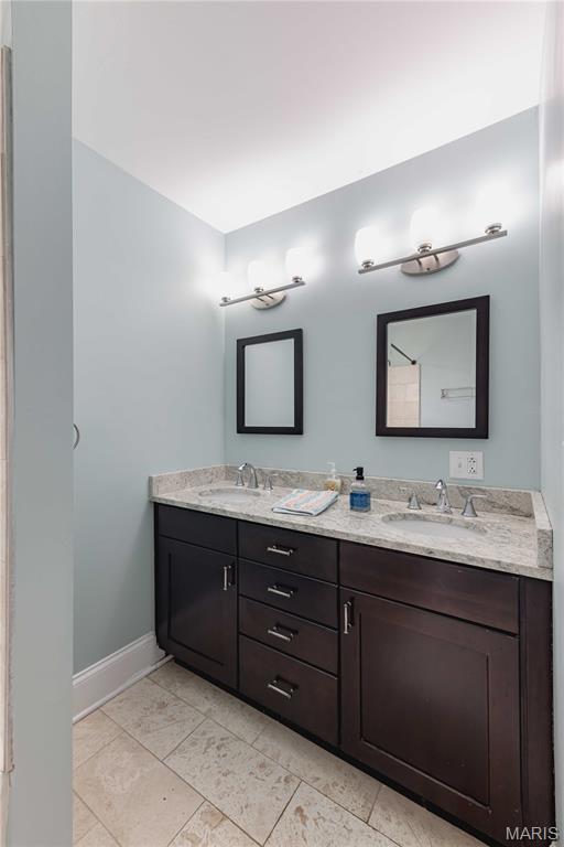 2244 Nebraska Ave, Saint Louis, MO 63104 - full bathroom featuring double vanity and baseboards