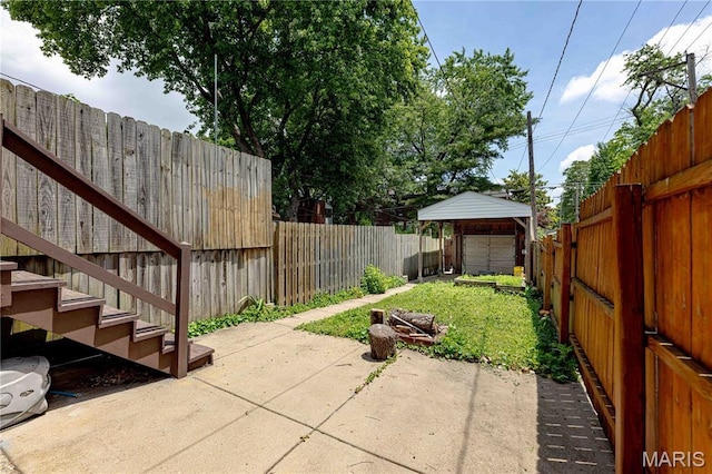 2244 Nebraska Ave, Saint Louis, MO 63104 - fenced backyard featuring a patio area and a garage