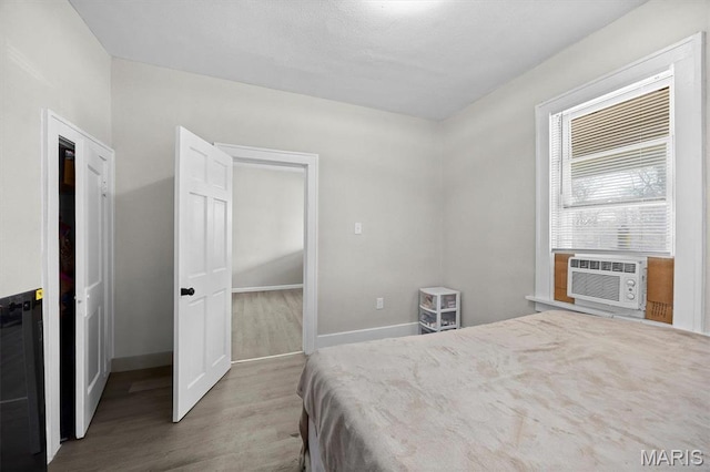 2339 Lincoln Ave, Granite City, IL 62040 - bedroom with wood finished floors, baseboards, and cooling unit