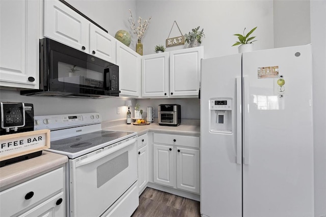 kitchen with white appliances, white cabinetry, dark wood finished floors, and light countertops
