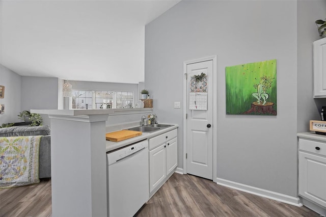 kitchen with dishwasher, a sink, dark wood-style flooring, and white cabinets