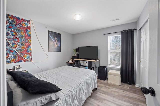 bedroom featuring wood finished floors