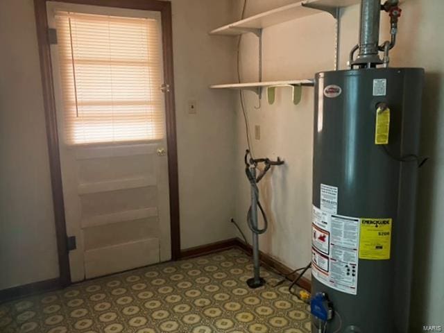 utility room featuring gas water heater