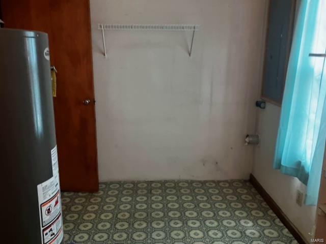 laundry room with gas water heater