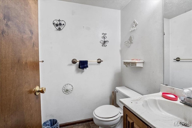 2208 Gillis St, Alton, IL 62002 - half bath featuring toilet, vanity, and a textured ceiling