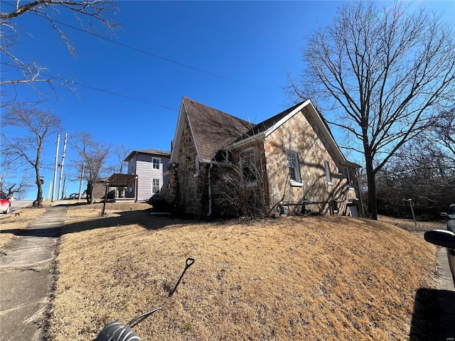 view of home's exterior featuring stone siding
