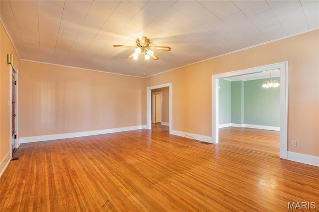 533 Locust St, Carrollton, IL 62016 - unfurnished room with light wood-style floors, a ceiling fan, ornamental molding, a chandelier, and baseboards