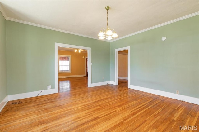 533 Locust St, Carrollton, IL 62016 - unfurnished room featuring light wood-style flooring, a chandelier, baseboards, and crown molding