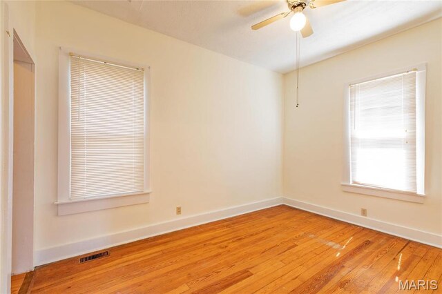 533 Locust St, Carrollton, IL 62016 - unfurnished room with light wood-style flooring, baseboards, and a ceiling fan