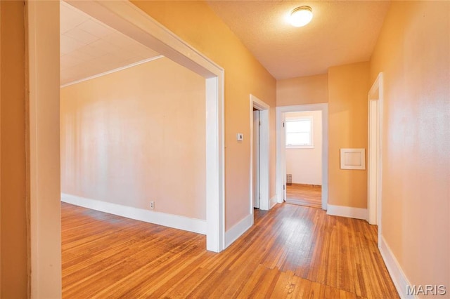 533 Locust St, Carrollton, IL 62016 - hall featuring light wood-style flooring and baseboards