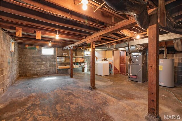 533 Locust St, Carrollton, IL 62016 - below grade area featuring water heater, washing machine and dryer, and heating unit