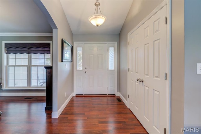 322 Gerard Ln, Moscow Mills, MO 63362 - entrance foyer featuring dark wood-style flooring, baseboards, and arched walkways