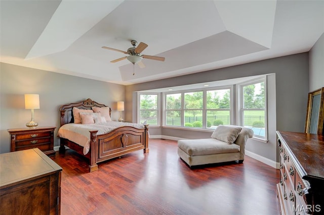322 Gerard Ln, Moscow Mills, MO 63362 - bedroom with a raised ceiling, dark wood-type flooring, baseboards, and a ceiling fan