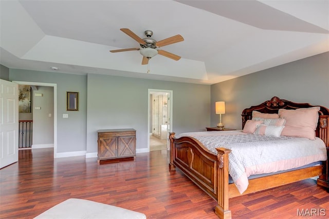 322 Gerard Ln, Moscow Mills, MO 63362 - bedroom with a tray ceiling, wood finished floors, baseboards, and a ceiling fan