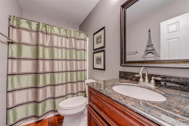 322 Gerard Ln, Moscow Mills, MO 63362 - full bathroom with toilet, vanity, wood finished floors, and a shower with curtain