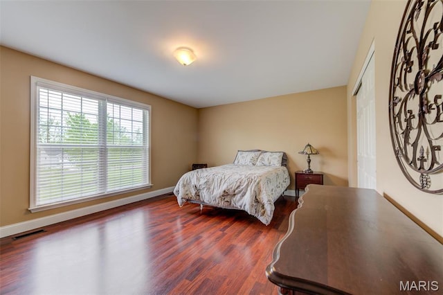 322 Gerard Ln, Moscow Mills, MO 63362 - bedroom featuring wood finished floors, baseboards, and a closet