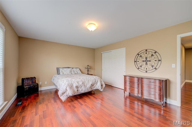 322 Gerard Ln, Moscow Mills, MO 63362 - bedroom with wood finished floors, baseboards, and a closet