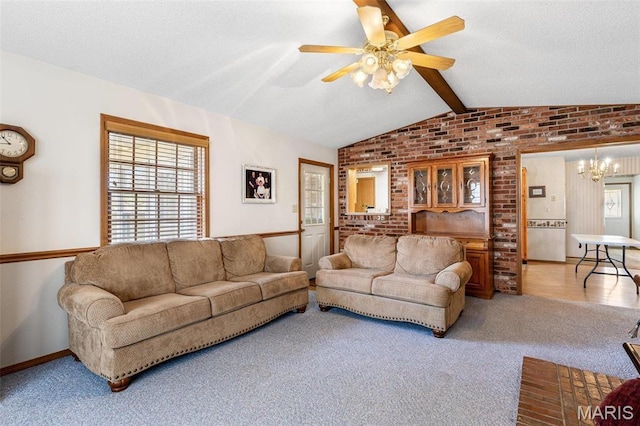 423 Rice Rd, Bonne Terre, MO 63628 - living area with brick wall, a chandelier, a ceiling fan, and carpet