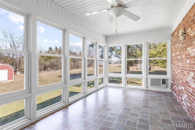 423 Rice Rd, Bonne Terre, MO 63628 - unfurnished sunroom with brick wall, a ceiling fan, plenty of natural light, and a wall mounted AC