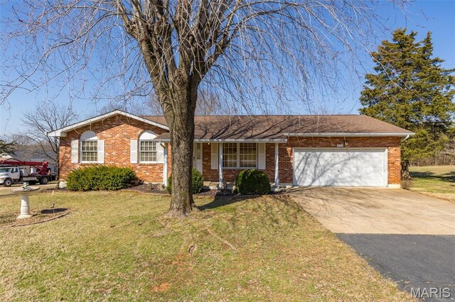 423 Rice Rd, Bonne Terre, MO 63628 - ranch-style house with concrete driveway, a front lawn, a garage, and brick siding