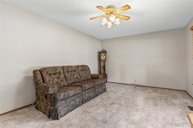 423 Rice Rd, Bonne Terre, MO 63628 - living room featuring carpet flooring, ceiling fan, and a textured ceiling