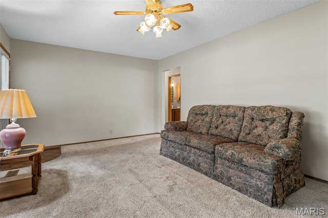 423 Rice Rd, Bonne Terre, MO 63628 - living area with carpet, ceiling fan, baseboards, and a textured ceiling